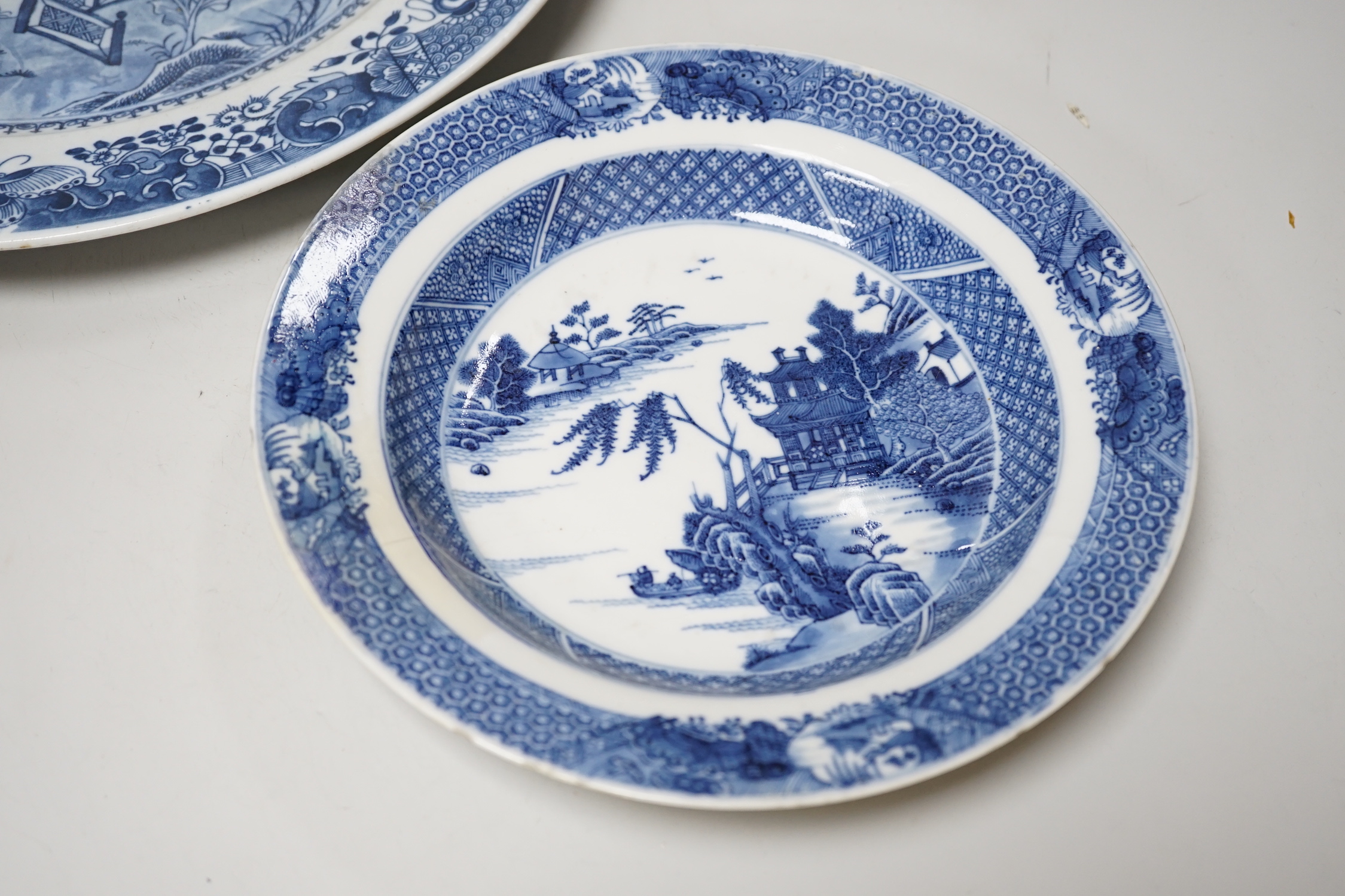 Two Chinese blue and white plates, 18th/19th century, largest 35cm